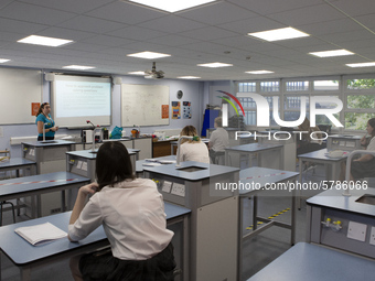  A view of a teacher teaching a class of Year 10 pupils. Ortu Gable Hall School in Corringham, Essex return after a long break due to the CO...