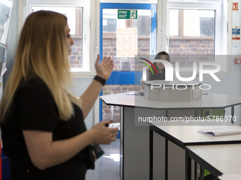  A Year 10 pupil watches on at the teacher . Ortu Gable Hall School in Corringham, Essex return after a long break due to the COVID-19 pande...