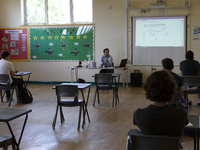   A teacher at the front of a class of Year 12 pupils. Ortu Gable Hall School in Corringham, Essex return after a long break due to the COVI...