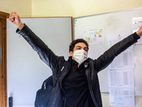 A student exults after the end of the exam in Turin, Italy on 17th June 2020. The final high school exam represents a return to class for st...