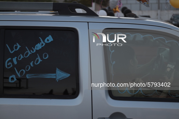 Ciudad Juarez High school students receive their diplomas inside their vehicles at a ''drive in'' graduation ceremony held at the Centro Cul...