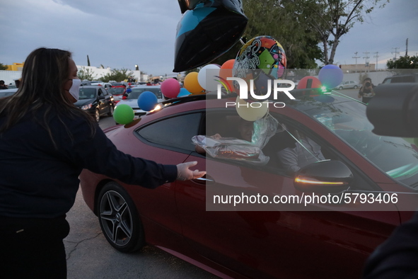 Ciudad Juarez High school students receive their diplomas inside their vehicles at a ''drive in'' graduation ceremony held at the Centro Cul...