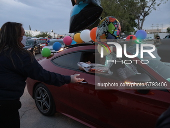 Ciudad Juarez High school students receive their diplomas inside their vehicles at a ''drive in'' graduation ceremony held at the Centro Cul...