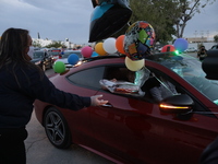 Ciudad Juarez High school students receive their diplomas inside their vehicles at a ''drive in'' graduation ceremony held at the Centro Cul...