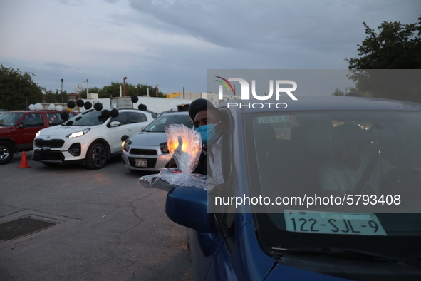 Ciudad Juarez High school students receive their diplomas inside their vehicles at a ''drive in'' graduation ceremony held at the Centro Cul...