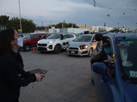 Ciudad Juarez High school students receive their diplomas inside their vehicles at a ''drive in'' graduation ceremony held at the Centro Cul...