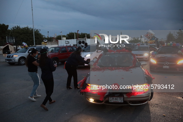 Ciudad Juarez High school students receive their diplomas inside their vehicles at a ''drive in'' graduation ceremony held at the Centro Cul...