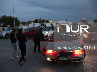 Ciudad Juarez High school students receive their diplomas inside their vehicles at a ''drive in'' graduation ceremony held at the Centro Cul...