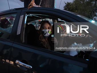 Ciudad Juarez High school students receive their diplomas inside their vehicles at a ''drive in'' graduation ceremony held at the Centro Cul...