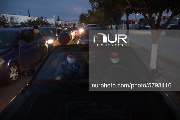 Ciudad Juarez High school students receive their diplomas inside their vehicles at a ''drive in'' graduation ceremony held at the Centro Cul...