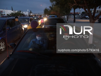 Ciudad Juarez High school students receive their diplomas inside their vehicles at a ''drive in'' graduation ceremony held at the Centro Cul...