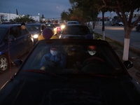 Ciudad Juarez High school students receive their diplomas inside their vehicles at a ''drive in'' graduation ceremony held at the Centro Cul...