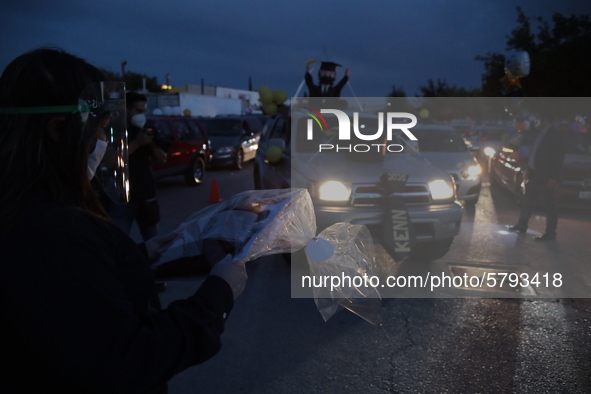 Ciudad Juarez High school students receive their diplomas inside their vehicles at a ''drive in'' graduation ceremony held at the Centro Cul...