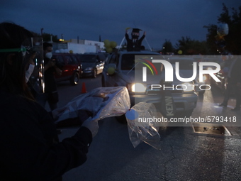 Ciudad Juarez High school students receive their diplomas inside their vehicles at a ''drive in'' graduation ceremony held at the Centro Cul...