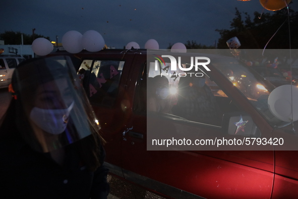 Ciudad Juarez High school students receive their diplomas inside their vehicles at a ''drive in'' graduation ceremony held at the Centro Cul...