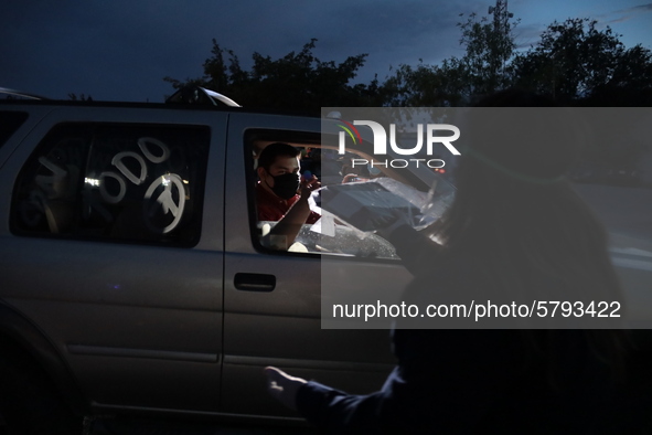 Ciudad Juarez High school students receive their diplomas inside their vehicles at a ''drive in'' graduation ceremony held at the Centro Cul...