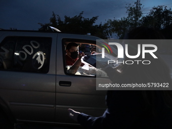 Ciudad Juarez High school students receive their diplomas inside their vehicles at a ''drive in'' graduation ceremony held at the Centro Cul...