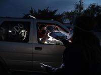 Ciudad Juarez High school students receive their diplomas inside their vehicles at a ''drive in'' graduation ceremony held at the Centro Cul...