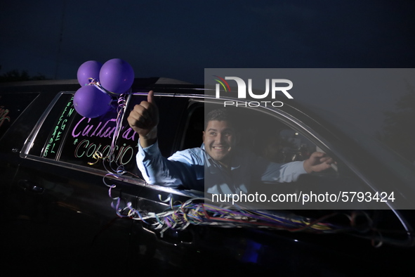 Ciudad Juarez High school students receive their diplomas inside their vehicles at a ''drive in'' graduation ceremony held at the Centro Cul...