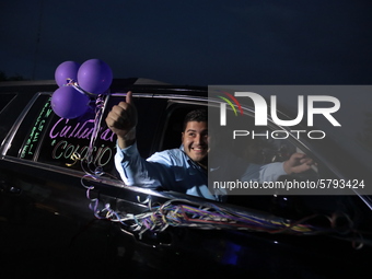 Ciudad Juarez High school students receive their diplomas inside their vehicles at a ''drive in'' graduation ceremony held at the Centro Cul...