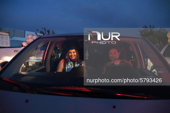 Ciudad Juarez High school students receive their diplomas inside their vehicles at a ''drive in'' graduation ceremony held at the Centro Cul...