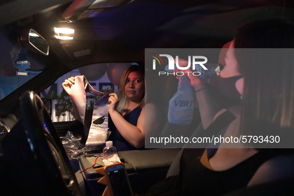 Ciudad Juarez High school students receive their diplomas inside their vehicles at a ''drive in'' graduation ceremony held at the Centro Cul...