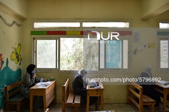 Egyptian high school students wear protective face masks as they attend the first day of final exams on June 21, 2020 in Cairo, Egypt. 