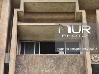 High school student wearing face mask look out of a window during the first day of the final exams, on June 21, 2020 in Cairo, Egypt. (