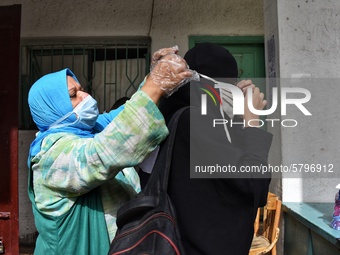 A student wearing a face mask before high school final exam due to the of Coronavirus pandemic on June 21, 2020 in Cairo, Egypt. (