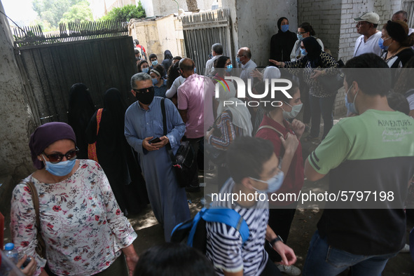 Hustle during the students ’exit from the Examination Committee during the first day of the high school exams in Giza Governorate, Egypt, on...