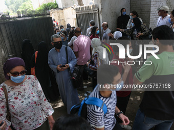 Hustle during the students ’exit from the Examination Committee during the first day of the high school exams in Giza Governorate, Egypt, on...