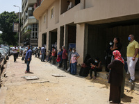 The parents waiting the students exit outside the examination committee during the first day of high school exams in Giza Governorate, Egypt...