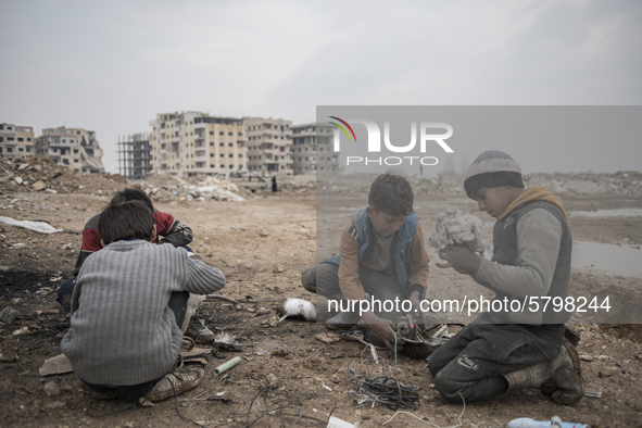 The boys at Al-Mliha, Syria on September 2, 2019 in the first phase of melting cooper, they filter the stuff and prepare it for the next pha...