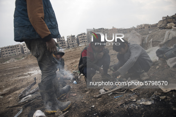 The final phase of melting cooper a group of boy at Al-Mliha, Damascus, Syria on September 2, 2019 melting the cooper that they filtered it...