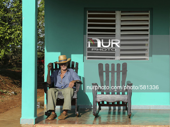 A farmer relaxes on his porch in Vinales, Cuba on May 7, 2015. Rocking chairs are a common site on the porches of most homes in Vinales. 

P...