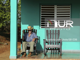 A farmer relaxes on his porch in Vinales, Cuba on May 7, 2015. Rocking chairs are a common site on the porches of most homes in Vinales. 

