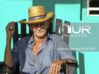 A farmer relaxes on his porch in Vinales, Cuba on May 7, 2015. Rocking chairs are a common site on the porches of most homes in Vinales. 

