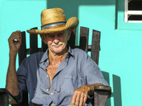 A farmer relaxes on his porch in Vinales, Cuba on May 7, 2015. Rocking chairs are a common site on the porches of most homes in Vinales. 

