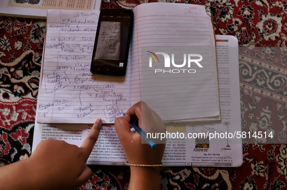 Kashmiri Students take Zoom Classes (online classes) at their home during Covid-19 (Coronavirus) lockdown in Sopore Town of district Baramul...