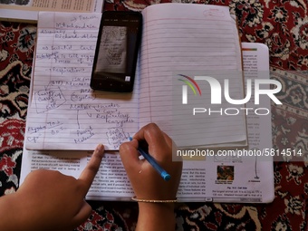 Kashmiri Students take Zoom Classes (online classes) at their home during Covid-19 (Coronavirus) lockdown in Sopore Town of district Baramul...