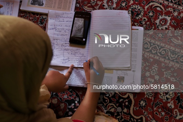 Kashmiri Students take Zoom Classes (online classes) at their home during Covid-19 (Coronavirus) lockdown in Sopore Town of district Baramul...