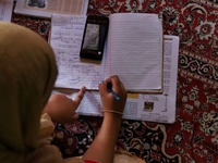 Kashmiri Students take Zoom Classes (online classes) at their home during Covid-19 (Coronavirus) lockdown in Sopore Town of district Baramul...