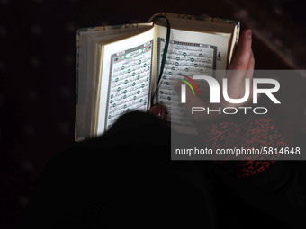 Girls keeping a safe distance from each other,attend a Koran memorization class as Palestinians ease the coronavirus disease (COVID-19) rest...