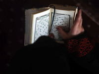 Girls keeping a safe distance from each other,attend a Koran memorization class as Palestinians ease the coronavirus disease (COVID-19) rest...