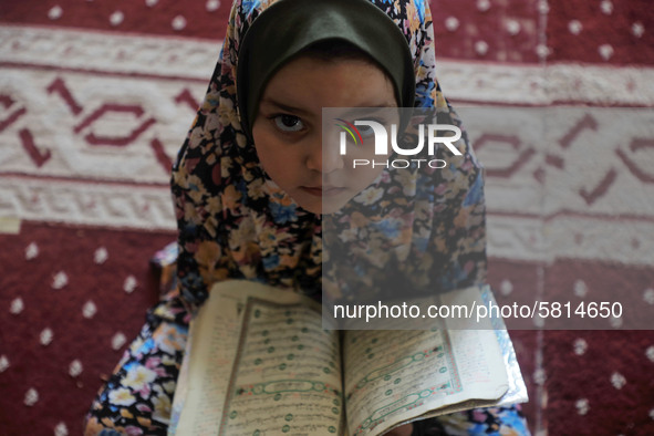 A girl attends a Koran memorization class as Palestinians ease the coronavirus disease (COVID-19) restrictions, in a mosque in Gaza City Jun...