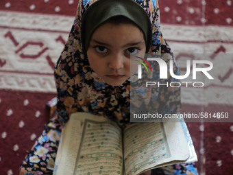 A girl attends a Koran memorization class as Palestinians ease the coronavirus disease (COVID-19) restrictions, in a mosque in Gaza City Jun...