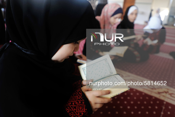 Girls attend a Koran memorization class as Palestinians ease the coronavirus disease (COVID-19) restrictions, in a mosque in Gaza City June...