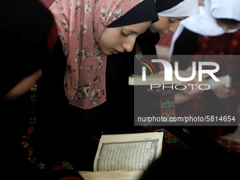 Girls attend a Koran memorization class as Palestinians ease the coronavirus disease (COVID-19) restrictions, in a mosque in Gaza City June...