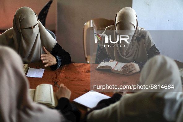 women keeping a safe distance from each other,attend a Koran memorization class as Palestinians ease the coronavirus disease (COVID-19) rest...