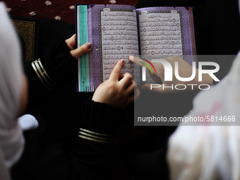 Girls attend a Koran memorization class as Palestinians ease the coronavirus disease (COVID-19) restrictions, in a mosque in Gaza City June...